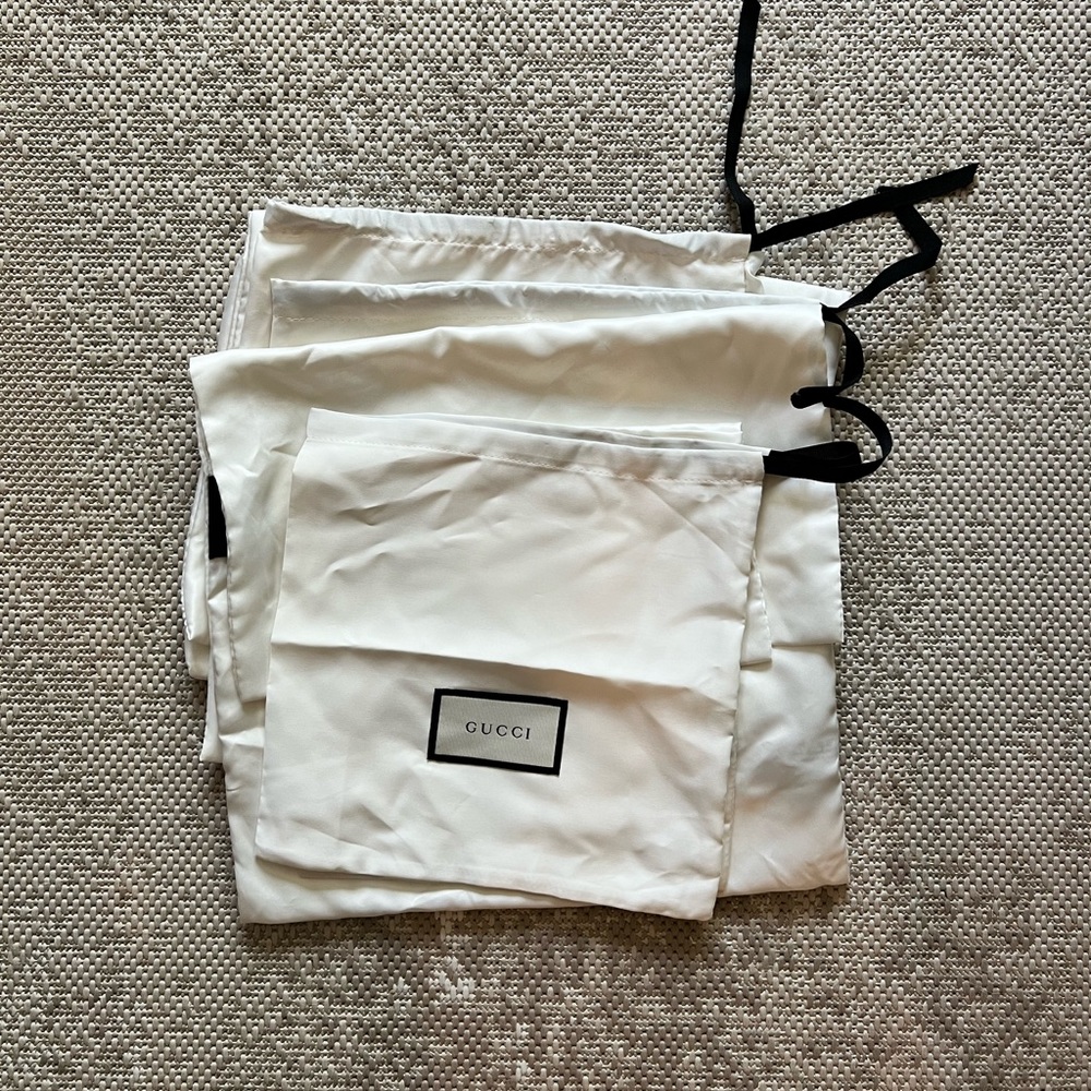 22 mixed Gucci dust bags. Can fit boots, wallets and medium size handbags.